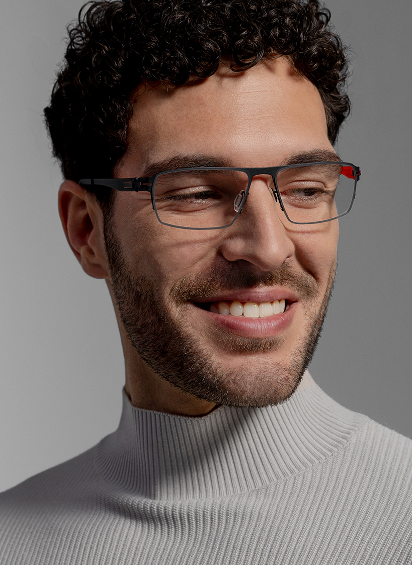 OVVO Optics close-up portrait of a smiling man in rectangular optical glasses