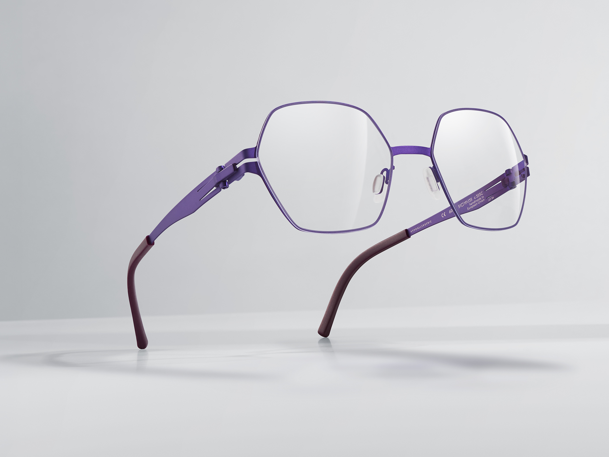 OVVO Optics purple geometric optical frame in a floating product shot on a light background