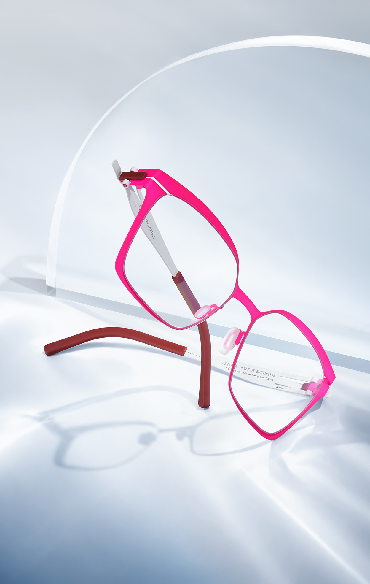 OVVO Optics green rectangular optical frame with orange temples in a studio product shot