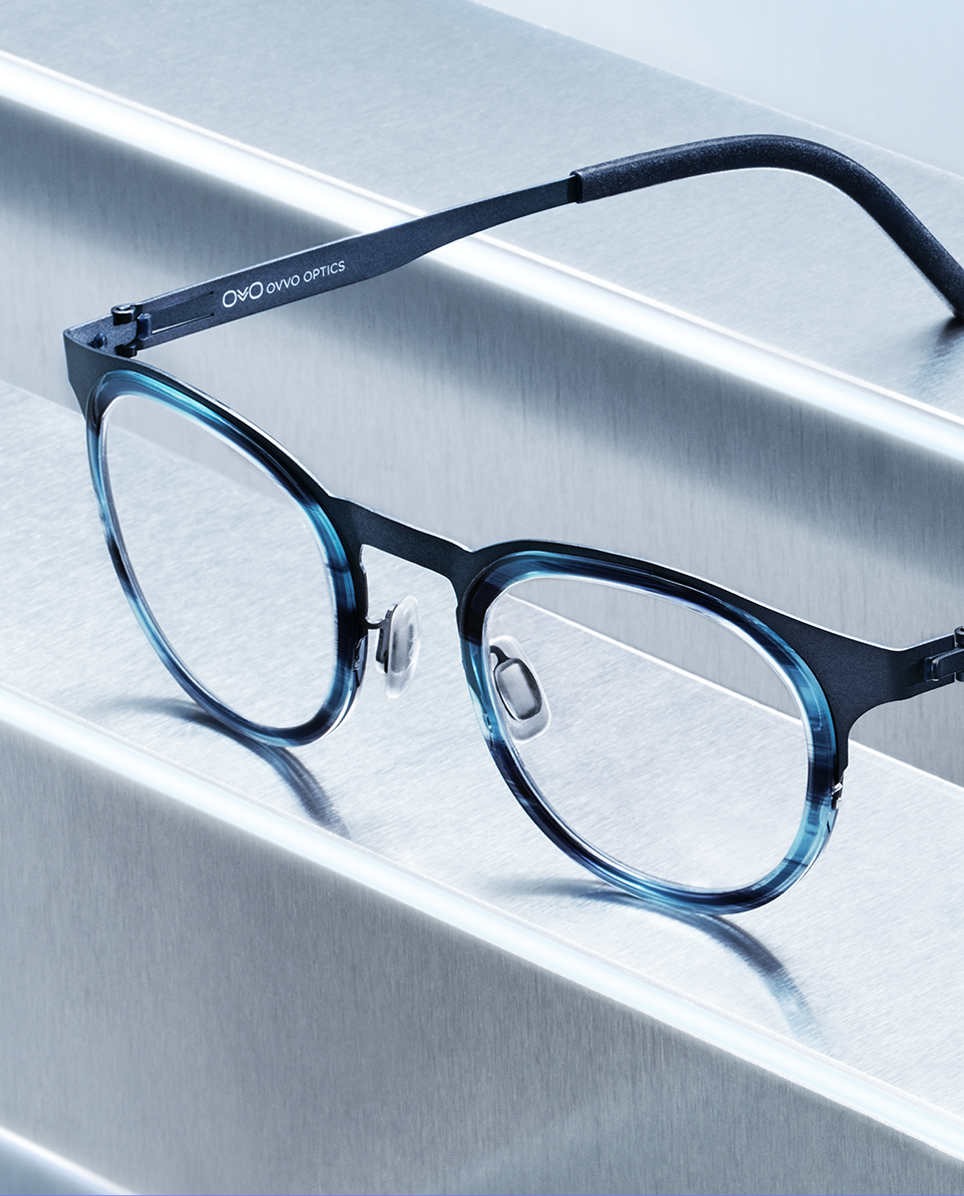 Close-up showing the fusion of durable surgical steel, lightweight titanium, and versatile acetate materials.