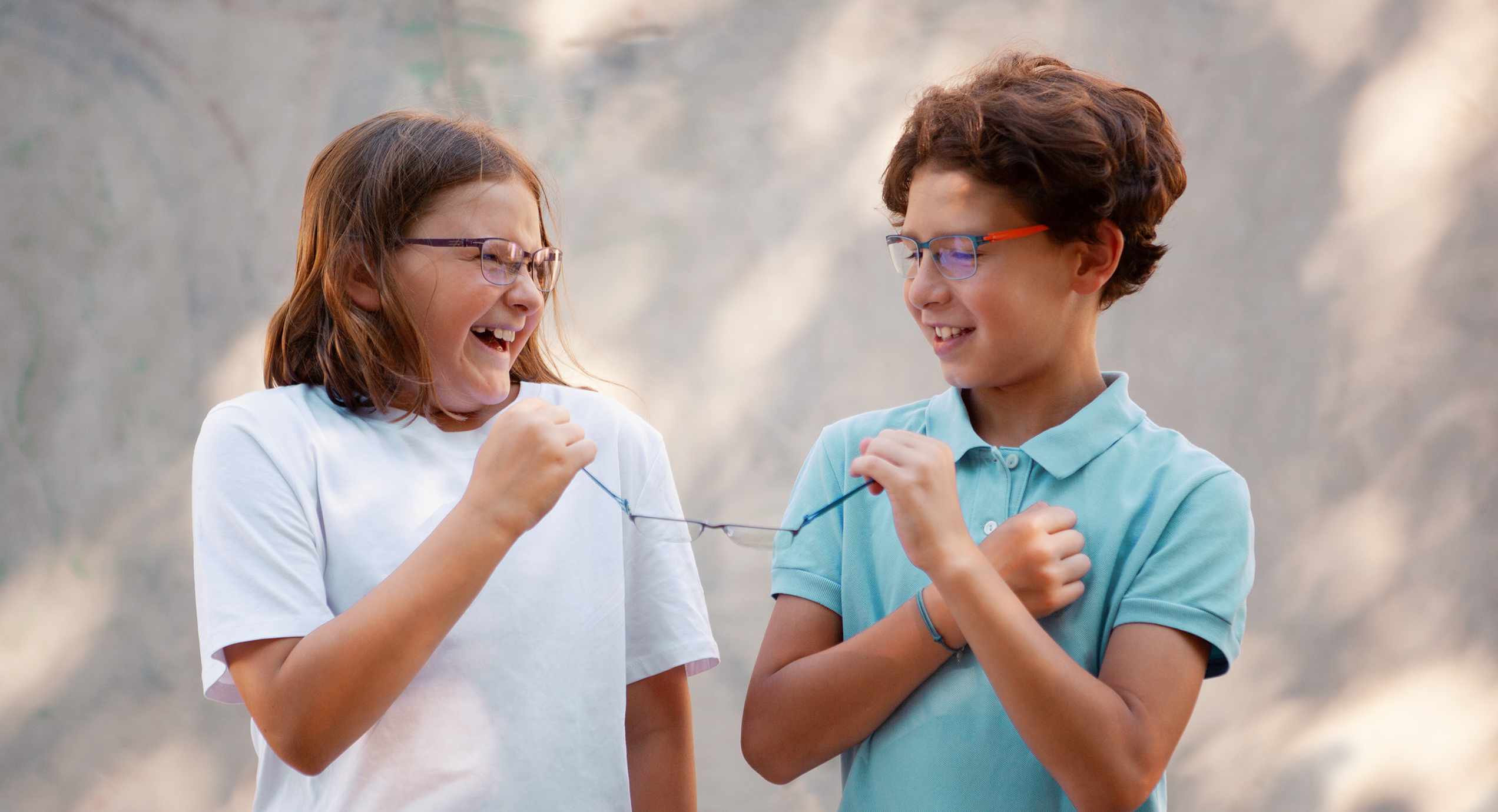Active kids wearing OVVO Optics Junior glasses designed for sports, school, and outdoor fun.