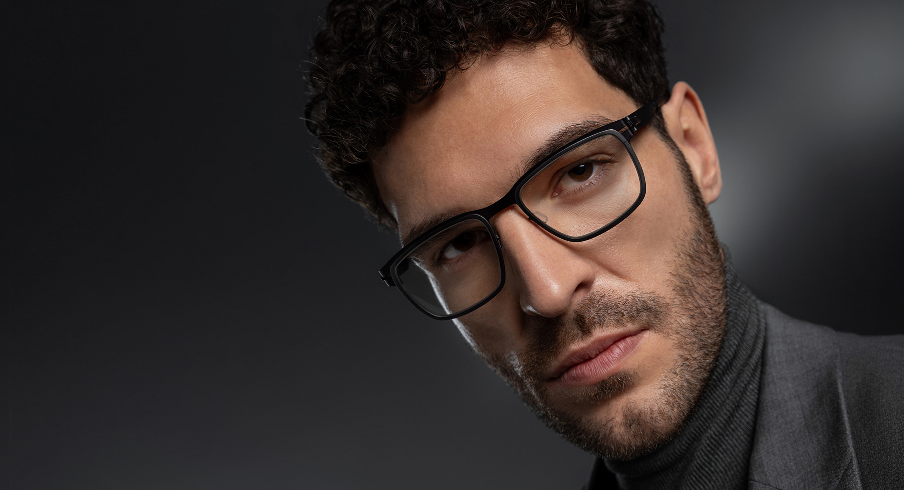 OVVO Optics Ti2 Hyperion optical frame portrait of a man wearing square titanium eyeglasses