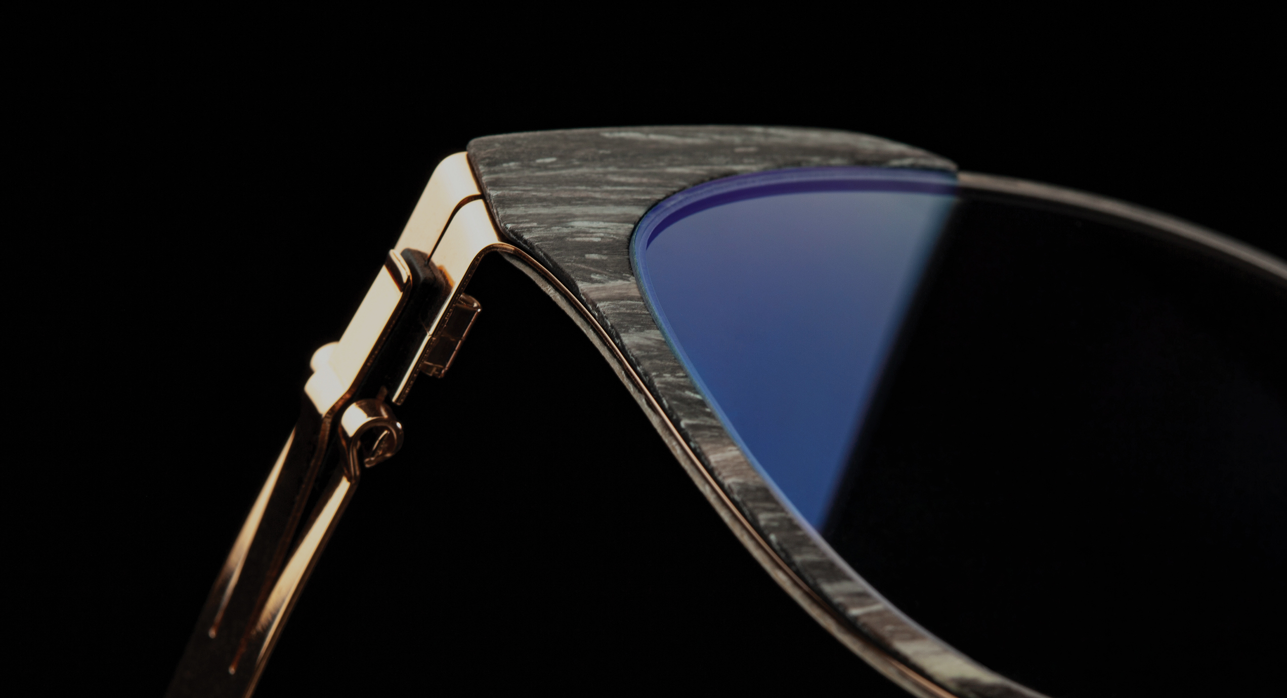 Close-up of premium handcrafted frames from the Wood & Carbon Fiber collection.