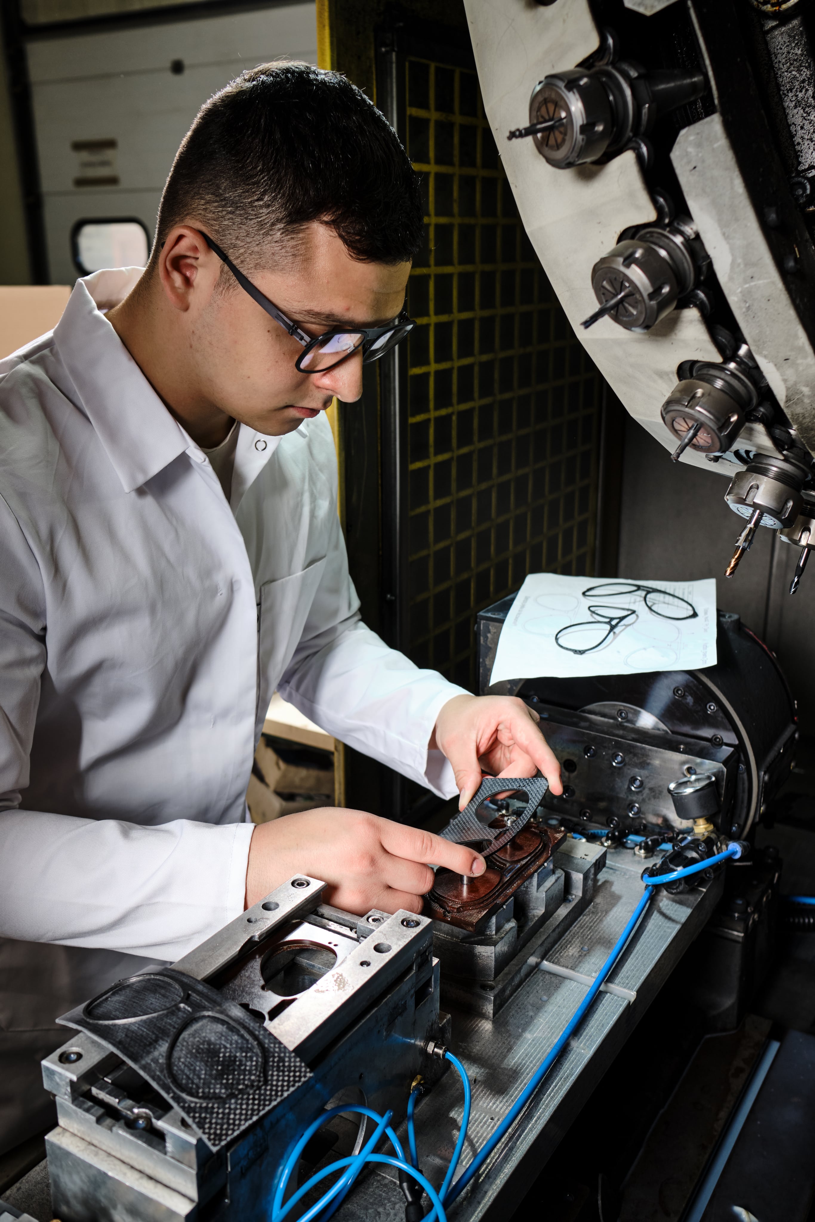 Skilled professionals at OVVO Optics ensuring precision and luxury in every handcrafted frame.
